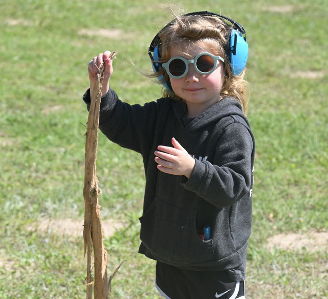 Three-yearold Miley Glick enjoys the annual Kindness from Case Shoot on Saturday. She is the daughter of Jacob and Haley Glick. Photo by Mitchell Pate/Recorder- Chronicle