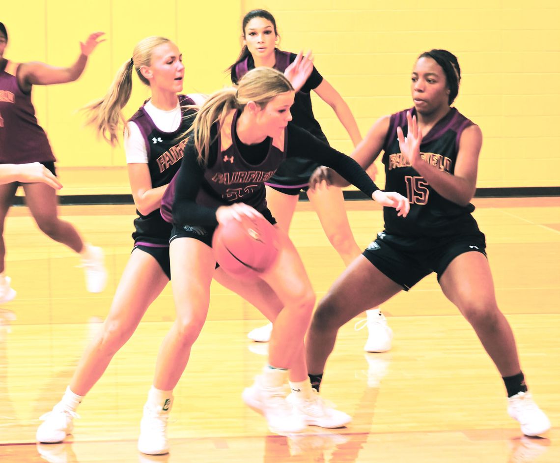 Jaclynn Schmidt dribbles the ball to the goal as Rhett Rhalstin, Jaci Abram, and Blayke Brackens play defense during practice. Photo by Mitchell Pate/Fairfield Recorder