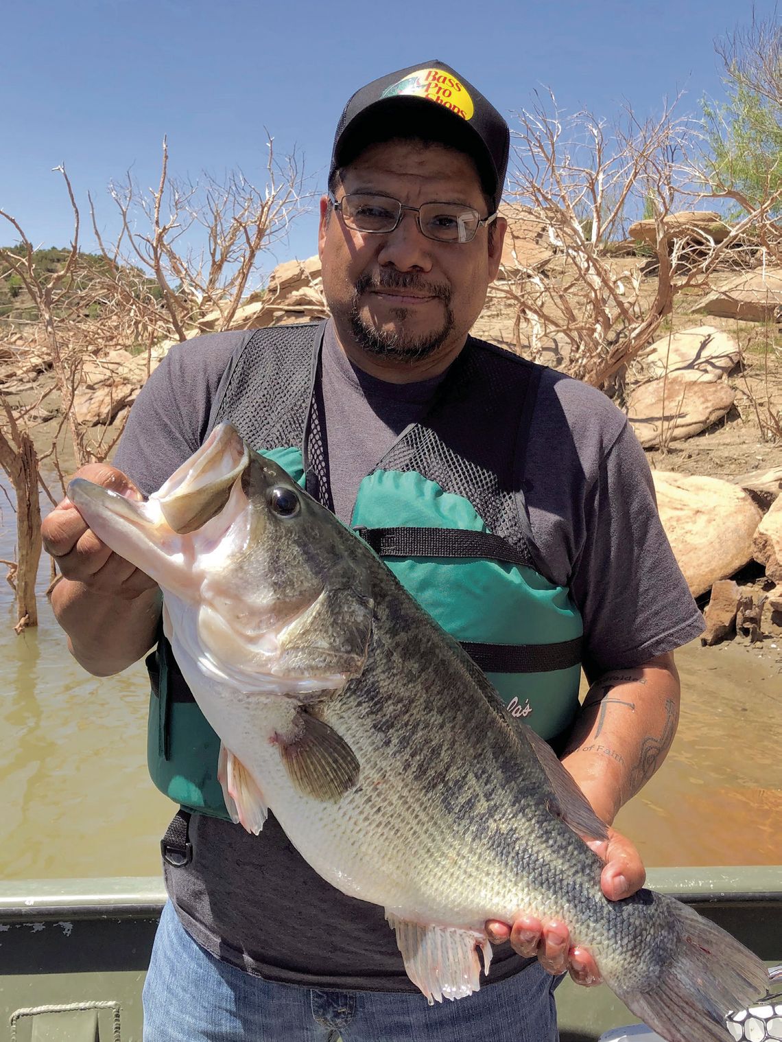 Ross Gomez with the 13.22-pound Toyota ShareLunker he caught while fishing from the public dock at Sam Wahl Recreation Area on Lake Alan Henry in February 2023. The fish produced nearly 34,000 fingerlings during its brief stay at the TFFC and was released back into Alan Henry the following...