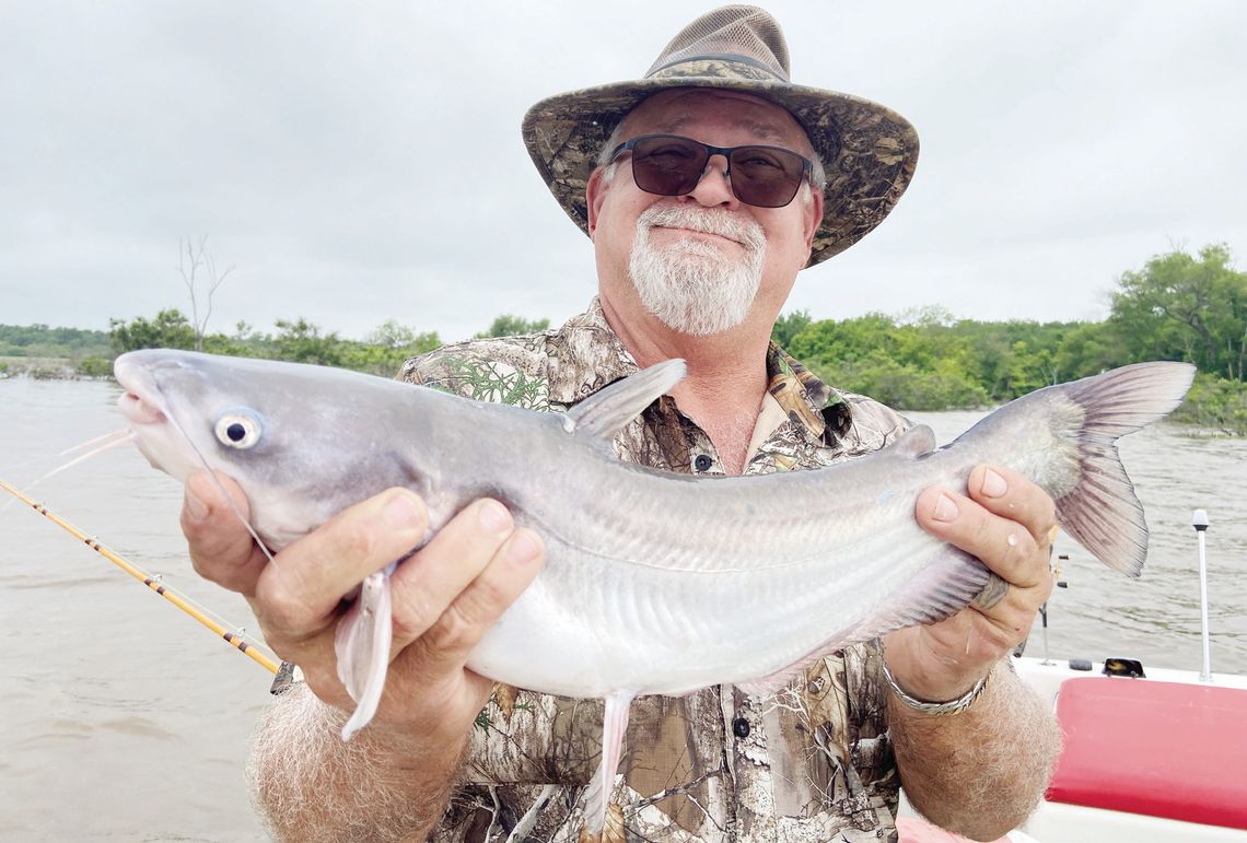 Guide David Hanson with one of many blue catfish he and Luke landed last week at Tawakoni, fishing the mouth of creeks. Photo by Luke Clayton