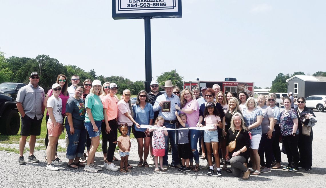 Family, friends, and community members gather on April 30 for the Grand Opening of Small Town Tees in Fairfield. Photo by Mitchell Pate/Fairfield Recorder
