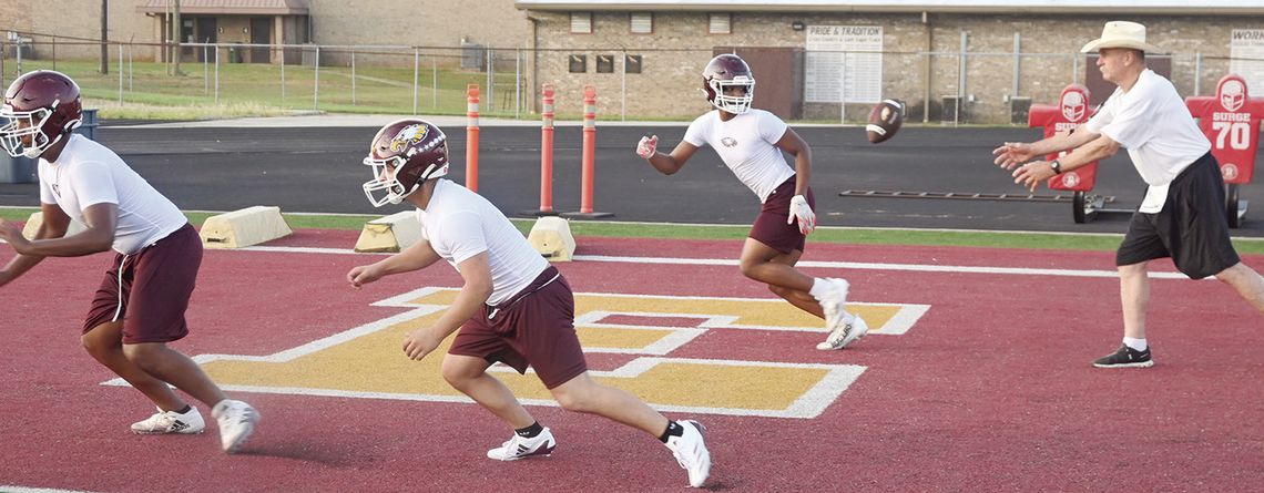 The Fairfield Eagle offense runs a play with Coach Max McGeary