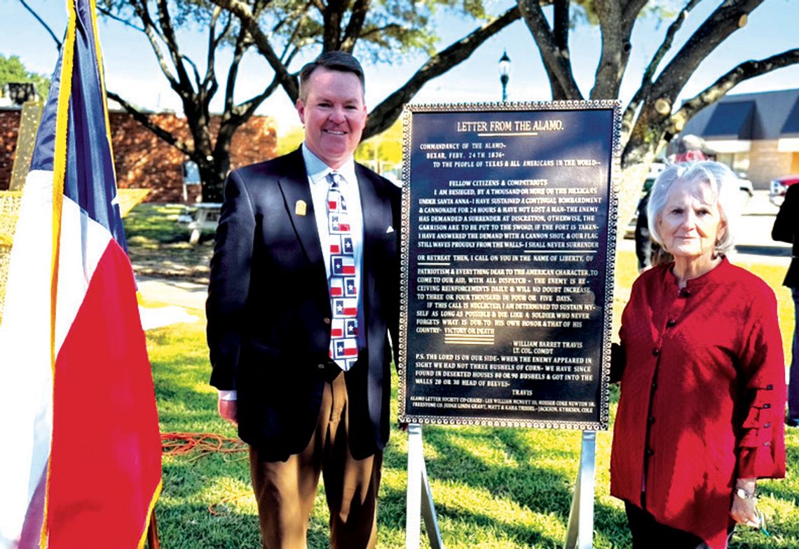 Dr. Danny Reeves with the Alamo Letter Society and Freestone County Judge Linda Grant pose for a photo with the “Victory of Death” letter plaque at the Freestone County Courthouse on Thursday, Nov. 14. Photo by Daryl Allen/Fairfield Recorder